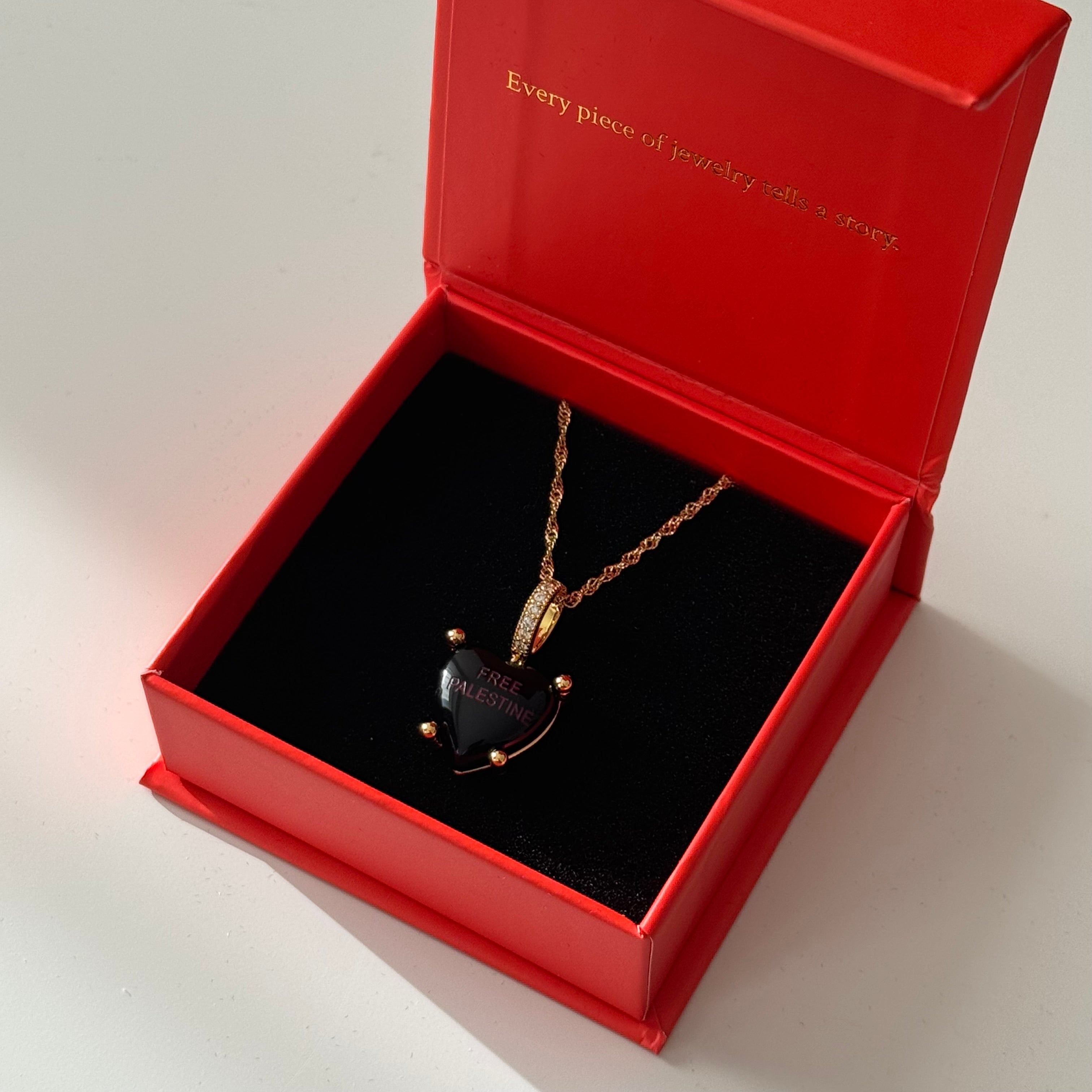 Midnight Charm with “Free Palestine” in purple with necklace