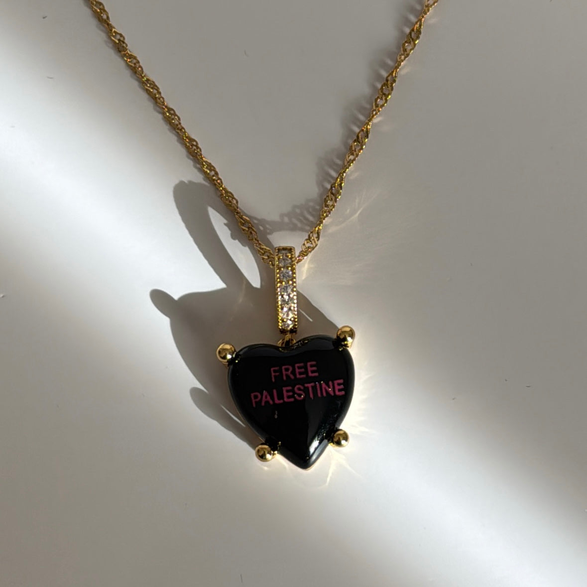 Midnight Charm with “Free Palestine” in purple with necklace